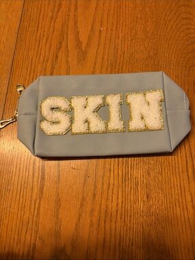 (5/$20) Blue Cosmetic Pouch with 'SKIN' Lettering